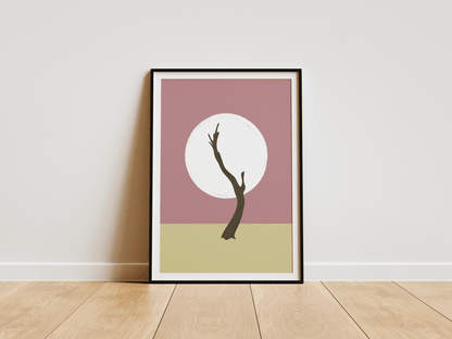 Framed artwork with a minimalist design of a Namibian tree silhouette against a circle on a pink and beige background, placed on a wooden floor.