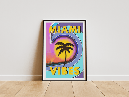 Framed 'Miami Vibes' poster with palm tree and colorful design on a white wall.