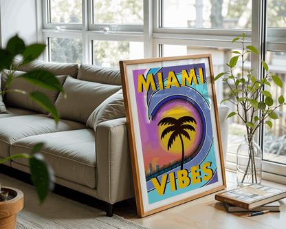 Framed 'Miami Vibes' poster on a table in a living room with a couch and plants.