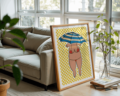 Framed artwork of a venus figurine with an umbrella on a yellow patterned background, displayed in a living room.