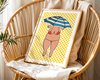 Framed artwork of a woman in a bikini with an umbrella on a yellow patterned background, sitting on a wicker chair.