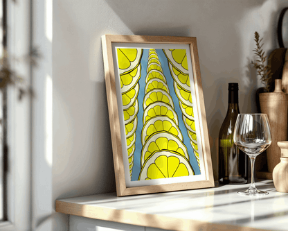 Framed artwork with a yellow and blue pattern on a shelf.