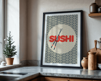Framed poster with 'SUSHI' text and chopsticks on a kitchen counter.