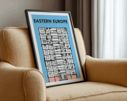 Framed artwork titled 'Eastern Europe' on a beige armchair.