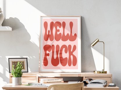 Framed artwork with bold text saying WELL FUCK on a desk in a home office setting